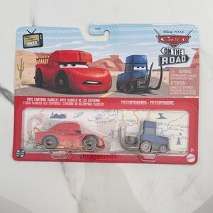 Disney Cars On The Road cave lightning McQueen and pitstoposaurus